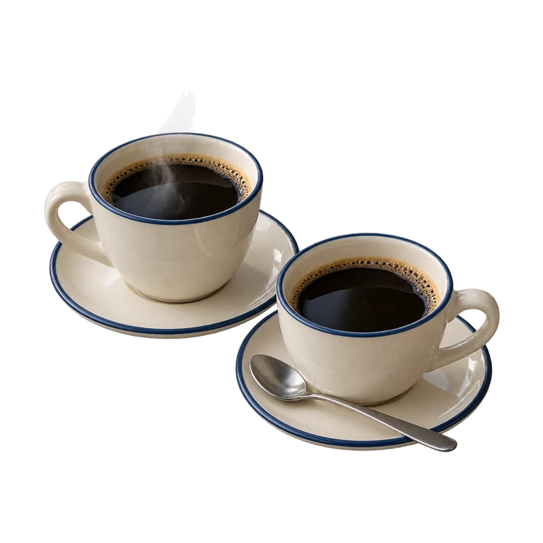 Twee kopjes koffie op schoteltjes